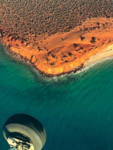 Aerial view of coastline and desert.