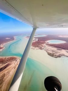 Aerial view of colorful waterways and landscapes.